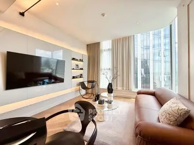 Luxurious modern living room with floor-to-ceiling windows and elegant furnishings in a high-rise apartment.