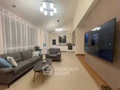 Spacious modern living room with open kitchen and stylish decor