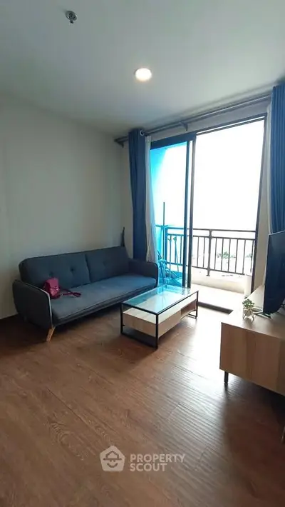 Modern living room with balcony access and stylish furniture