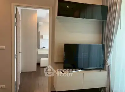 Modern living room with sleek TV unit and natural light