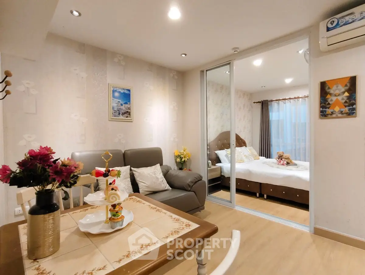 Cozy living room with elegant decor and adjacent bedroom in modern apartment