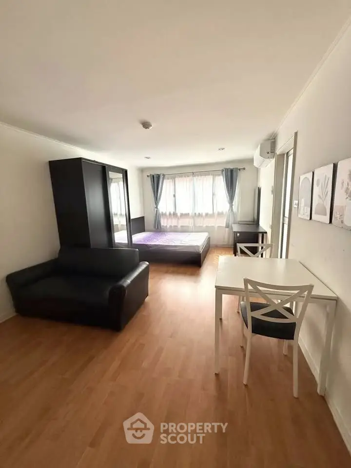 Spacious studio apartment with modern furnishings and natural light