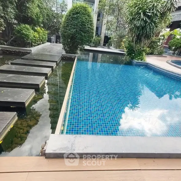 Luxurious outdoor pool with modern design and lush greenery