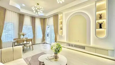 Elegant living room with modern decor and large windows for natural light.