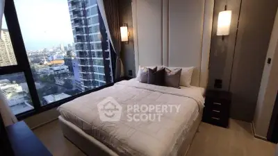 Luxurious bedroom with stunning city view in modern high-rise apartment