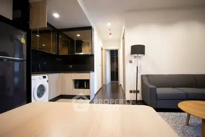 Modern apartment interior with sleek kitchen and cozy living room