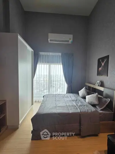 Modern bedroom with large window and stylish decor