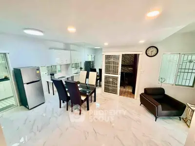 Spacious modern living room with dining area and sleek furnishings