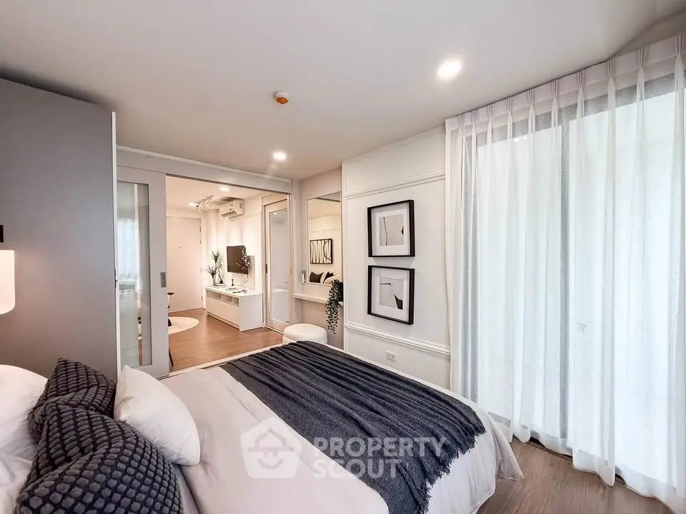 Luxurious bedroom with elegant decor and ample natural light