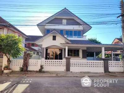 Charming two-story house with spacious front yard and modern design in a serene neighborhood.