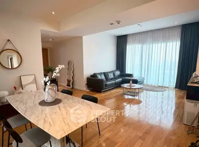 Spacious modern living room with hardwood floors and elegant decor