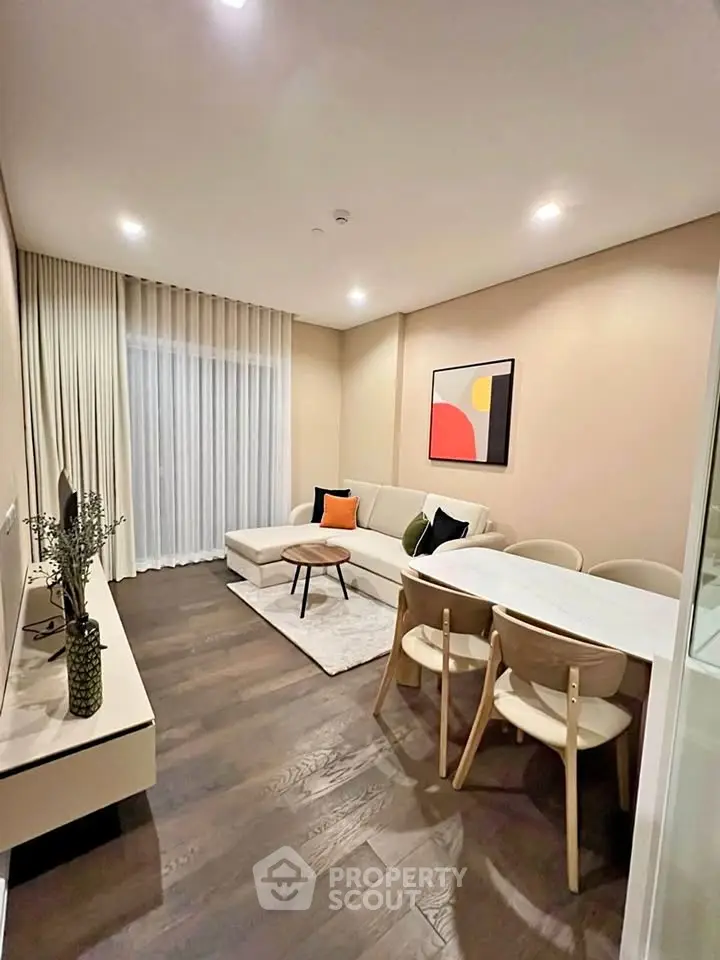 Modern living room with stylish decor and cozy seating area, perfect for relaxation and entertainment.