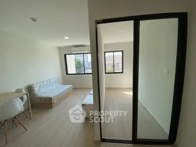 Modern living room with large windows and minimalistic design