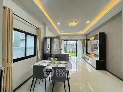 Modern living room with elegant dining area and garden view