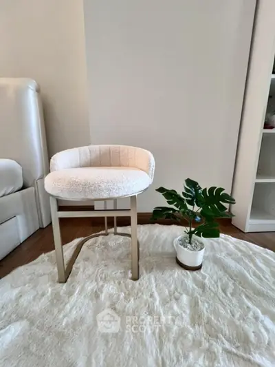 Stylish modern chair and plant in cozy living room corner