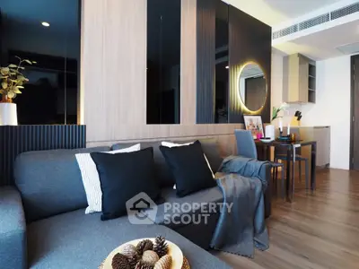 Modern living room with stylish decor and cozy seating area in a contemporary apartment.