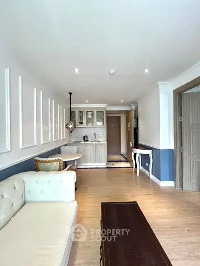 Elegant living room with open kitchen layout and stylish decor