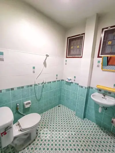 Spacious bathroom with modern fixtures and stylish tile design