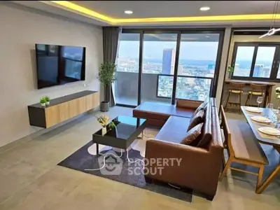 Modern living room with city view, stylish furniture, and open layout.