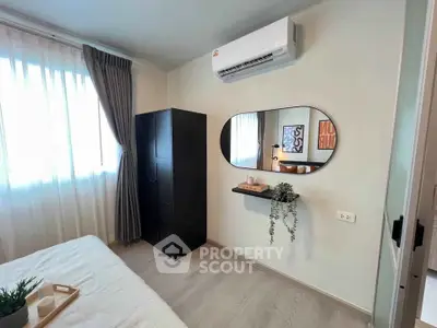 Modern bedroom with air conditioning and stylish decor