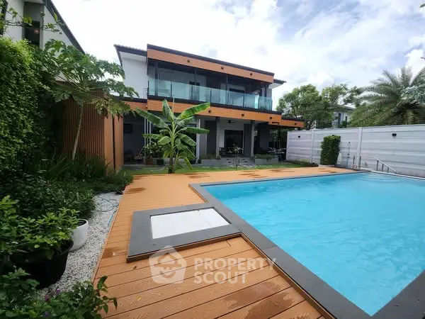 Luxurious modern home with private pool and lush garden, perfect for relaxation and entertainment.