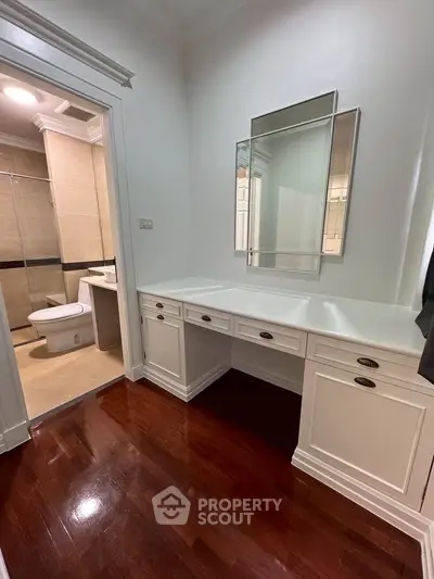 Elegant bathroom with vanity and polished wooden floors