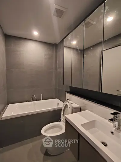 Modern bathroom with sleek design and bathtub in luxury apartment