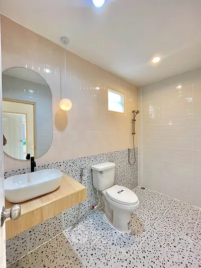Modern bathroom with terrazzo flooring and stylish fixtures