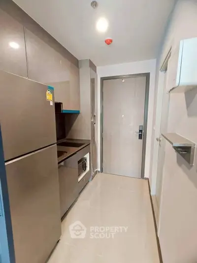 Modern compact kitchen with sleek appliances and stylish design