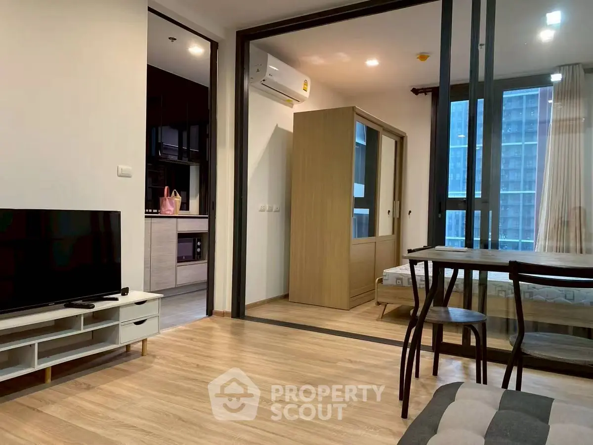 Modern apartment interior with open layout and wooden flooring