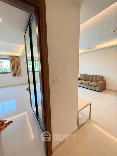 Spacious modern living room with sleek design and natural light