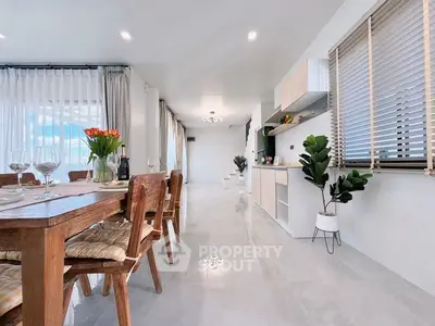 Spacious modern dining area with elegant decor and natural light