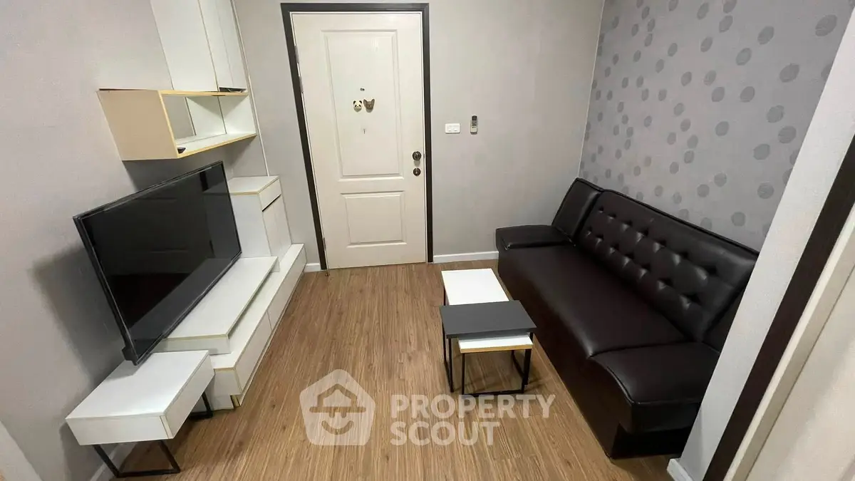 Modern living room with sleek furniture and stylish decor, perfect for urban living.