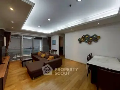 Spacious modern living room with elegant decor and wooden flooring