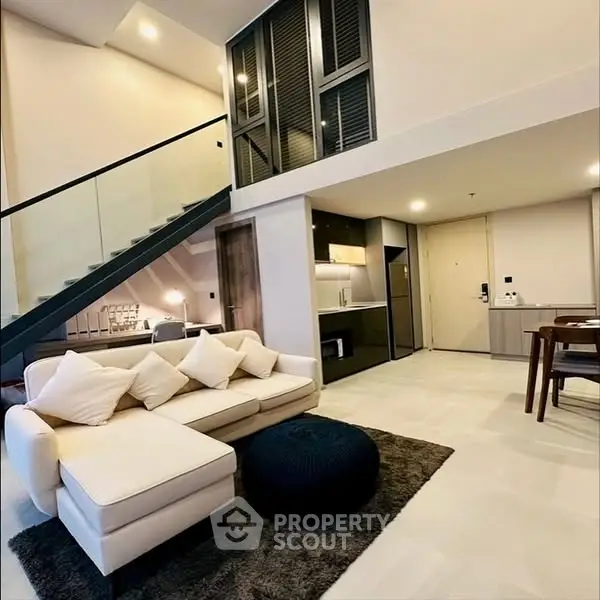 Modern loft apartment with open living area and stylish kitchen