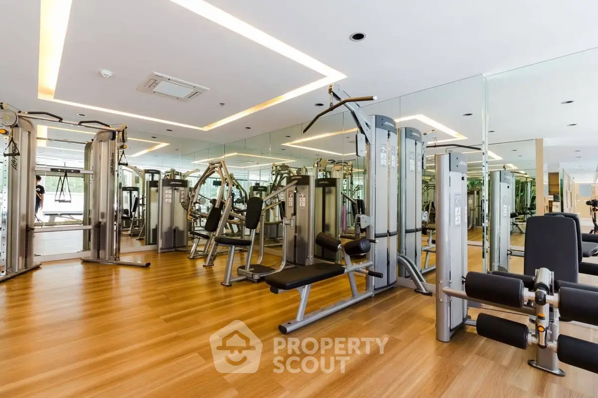 Spacious modern gym with state-of-the-art equipment and mirrored walls