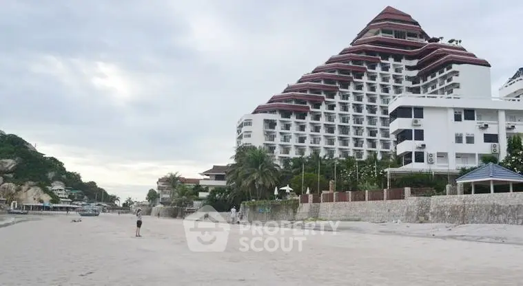 Stunning beachfront property with unique pyramid architecture and lush surroundings.