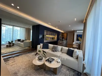 Luxurious modern living room with elegant decor and spacious seating area.