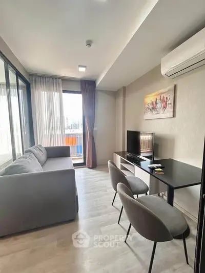Modern living room with sleek furniture and balcony view in a stylish apartment.