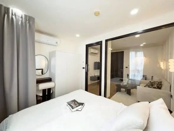 Modern bedroom with ensuite living area and stylish decor