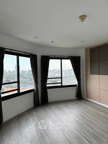 Spacious corner unit with panoramic city views and elegant flooring.