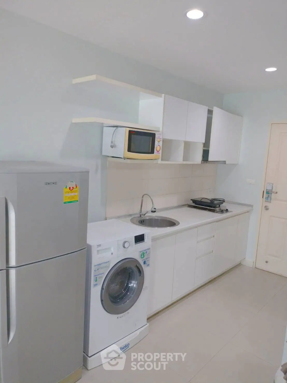 Modern kitchen with sleek appliances and ample storage space