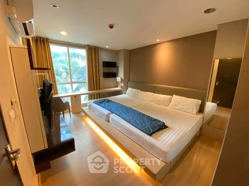 Luxurious bedroom with modern design and large window view