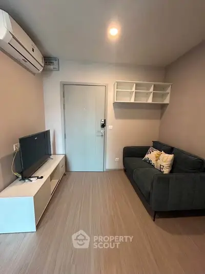 Cozy modern living room with stylish sofa and wall-mounted TV unit