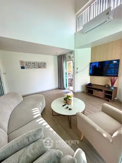 Spacious modern living room with stylish decor and natural light