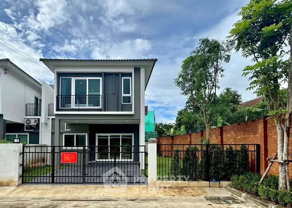 Modern two-story house with spacious garden and sleek design