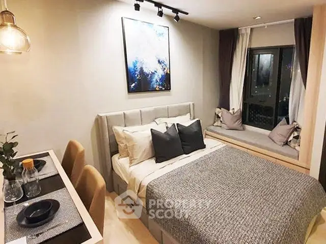 Cozy bedroom with modern decor and window seating in a stylish apartment.