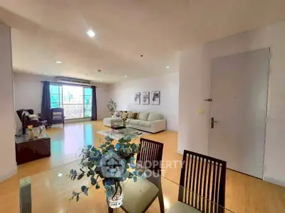 Spacious modern living room with elegant decor and city view