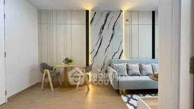 Modern living room with stylish decor and cozy seating area.