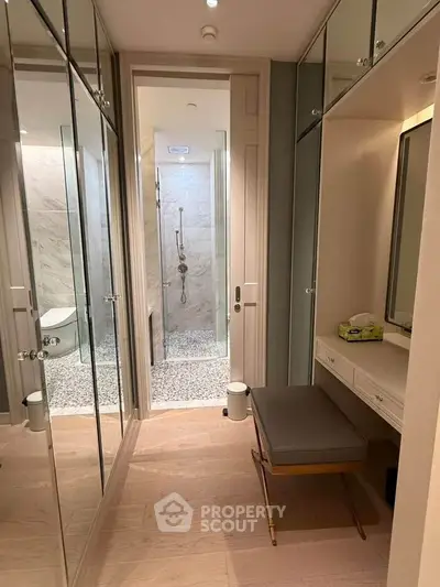 Luxurious bathroom with elegant mirrored cabinets and modern shower design